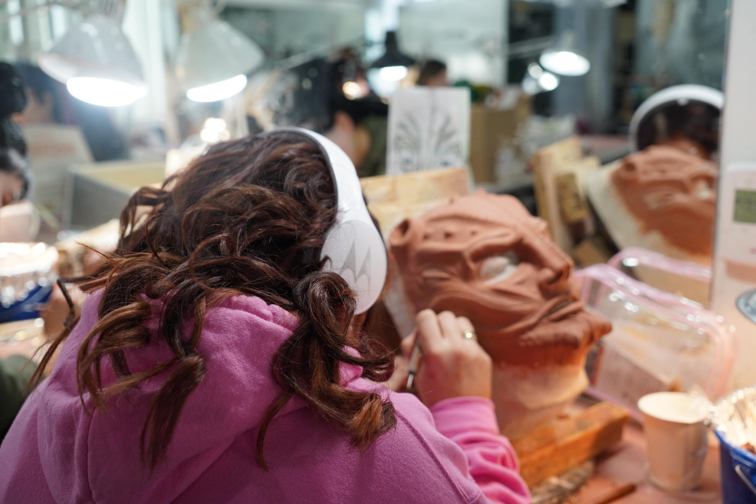 student painting a prosthetic