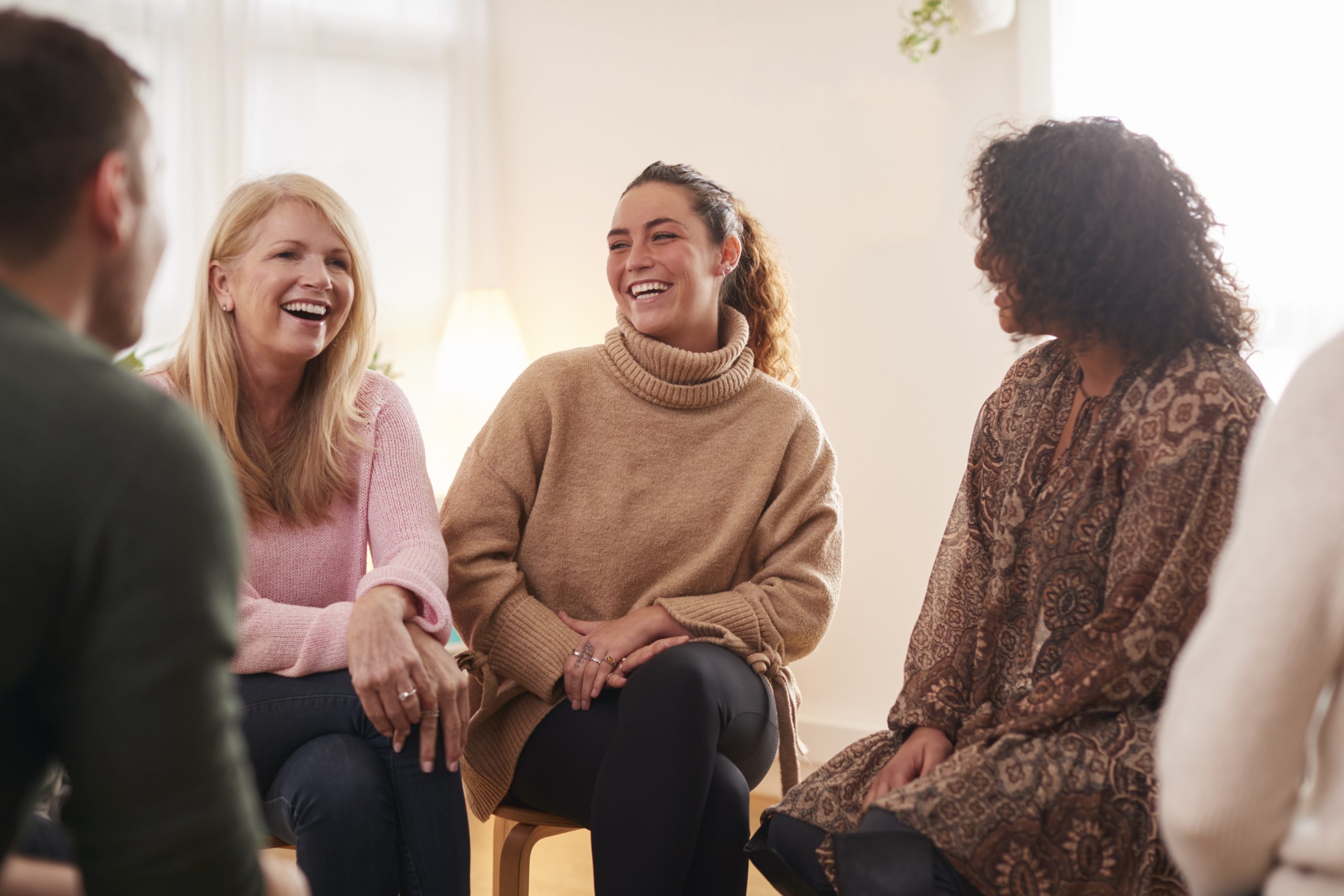 People Attending Support Group Meeting For Mental Health In Community Space