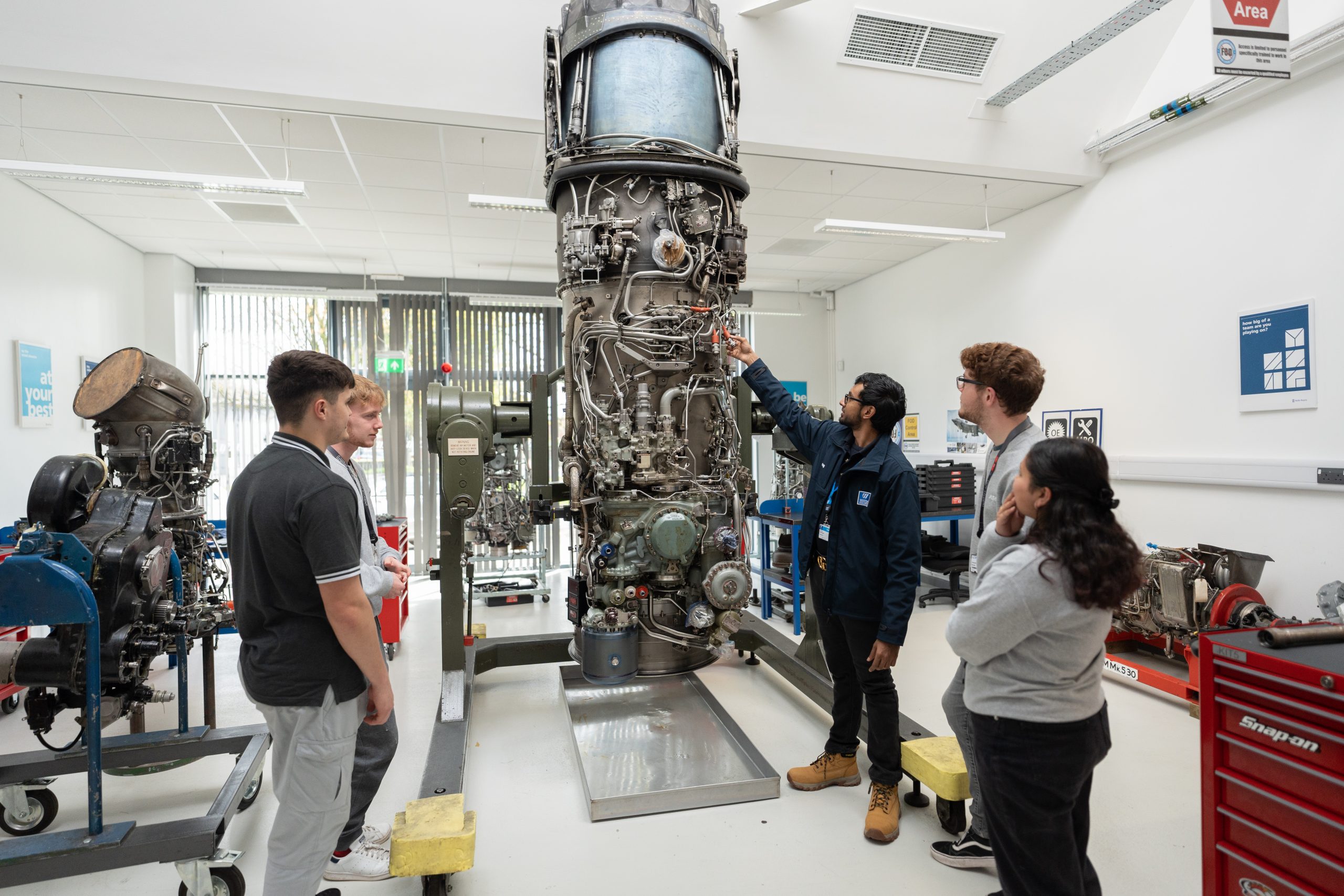 UCW Students gathered in an engineering classroom